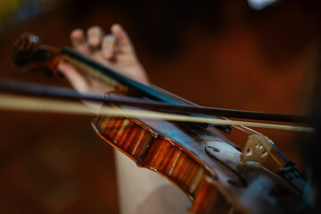 Closeup of a violinist playing violin, focus on the violin