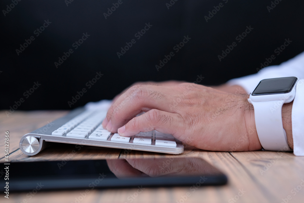 Poster businessman working on computer in office, closed up typing keyboard