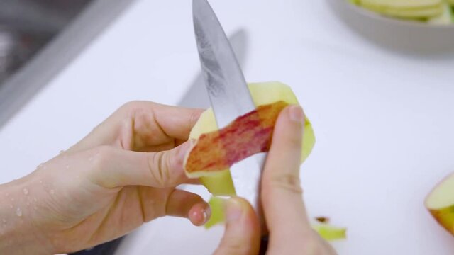 Closeup - peeling a pice of apple.