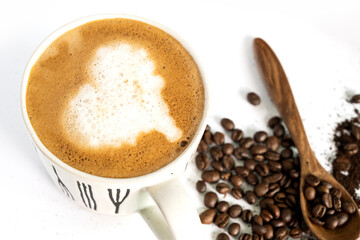 hot latte and coffee beans on white background