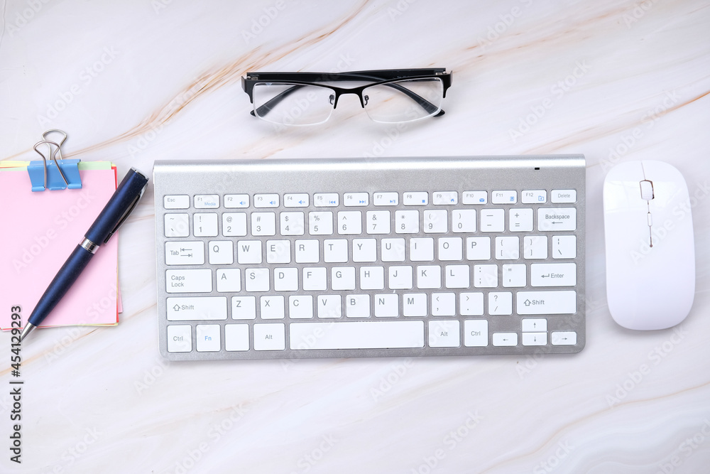Poster top view on working space with office equipment and keyboard on table background