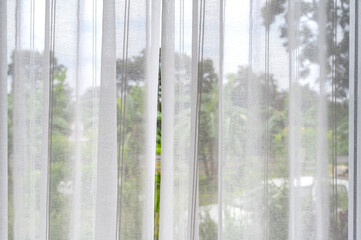Curtains or blinds made of linen is thin and airy to see the scenery outside.