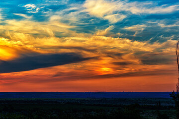 The landscape of a colorful sunset over the plain