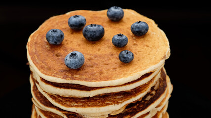 Pancakes with blueberry black background