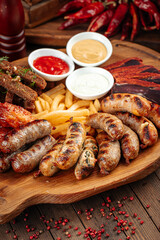 Wooden tray of beer appetizers set assortment with sauces
