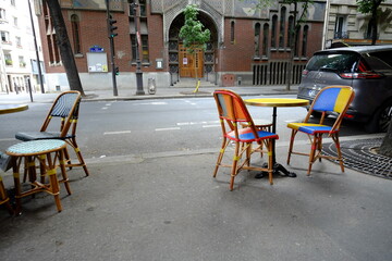Fototapeta na wymiar Some chairs and some tables of a typical Parisian cafe.