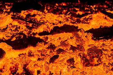 Looking at the lavaflow from the erupting volcanic crater of Geldingadalagos eruption in Reykjanes...