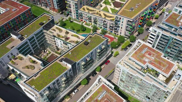 Buildings In Modern Housing Estate With Green Roof Covered With Vegetation