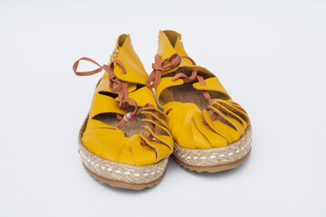 A pair of handmade suede leather sandals in ancient greek and roman style. Selective Focus.