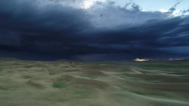 Aerial panorama storm clouds over sand desert Mongol Els