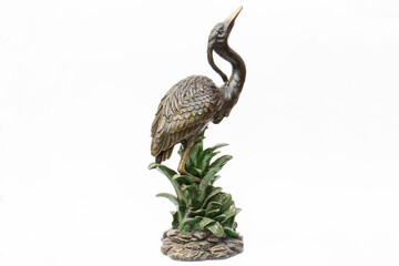 a blue heron statue designed for decorative purposes. isolated. White Background.
