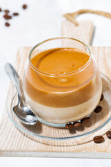 milky coffee with cream foam, vertical top view