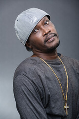 Young man offers a variety of poses and attitudes during a studio photo session
