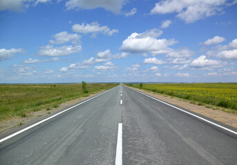 the road to the clouds through the fields