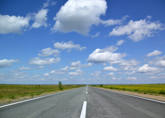 the road to the clouds through the fields
