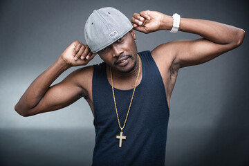 Young man offers a variety of poses and attitudes during a studio photo session