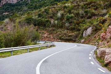 Asphalt road. Landscape with rocks and beautiful mountain road with a perfect asphalt. Vintage toning. Travel background. Highway in european mountains