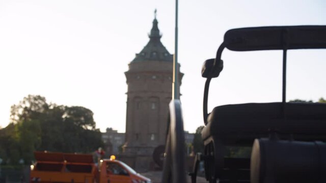 old car with three wheels, Old Water Tower in City