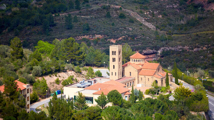Fototapeta na wymiar Church of the Mare de Deu del Roser, Our Lady of rosary, Neo-Romanesque cultural heritage and place of worship. Monistrol de Montserrat, Province of Barcelona Spain