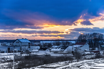 Sunset over the village. Sunset sunset in the clouds. Sunset sunset over the rooftops.