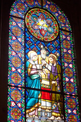 Montserrat, Spain - April 5, 2019: Stained-glass window in Benedictine Abbey of Santa Maria de Montserrat founded in 1025.