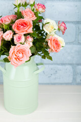 Bouquet of pink roses in a green vase