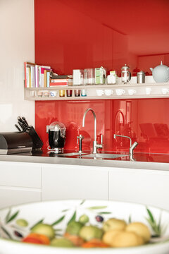Kitchen interior with red splashback