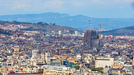 View above on Barcelona from Montjuic hill. Sagrada Familia cathedral.