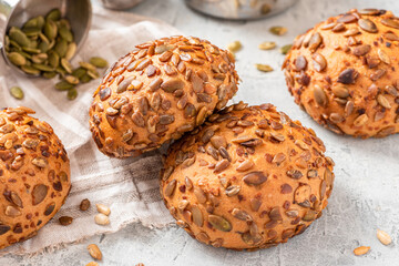 Gluten-free bread from corn flour and seeds close-up. Homemade bread with pumpkin and sunflower seeds. Breakfast buns.