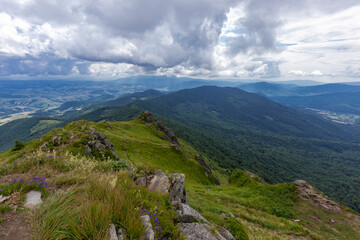 Naklejka premium Verkhovyna Watershed Range, Pikui Mountain. Carpathian mountains with grassy slopes and rocks on Pikuy mount. Beautiful mountain landscape in summer. Mountain summer landscape. photo wall-paper.