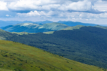 Obraz premium Verkhovyna Watershed Range, Pikui Mountain. Carpathian mountains with grassy slopes and rocks on Pikuy mount. Beautiful mountain landscape in summer. Mountain summer landscape. photo wall-paper.