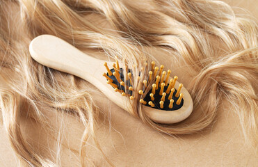 Blond wavy hair and care comb brush