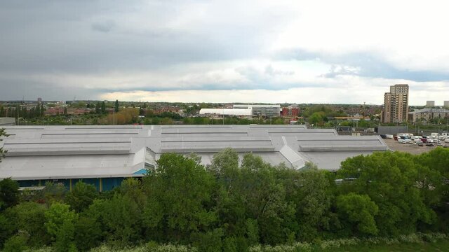 Football Pitch Next To Industrial Hall, Production Or Warehouse Building