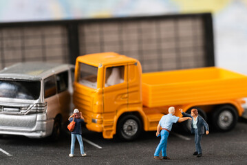 Miniature people aggrieved party dispute car accident in public road street using for Car Automotive maintenance repair fixed or replacement Service or Vehicle Insurance guarantee or drive safety
