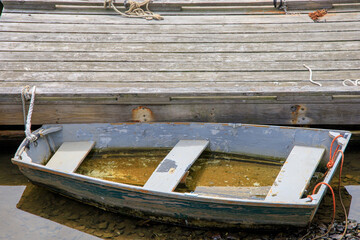 Wooden boats near a dock in the harbor