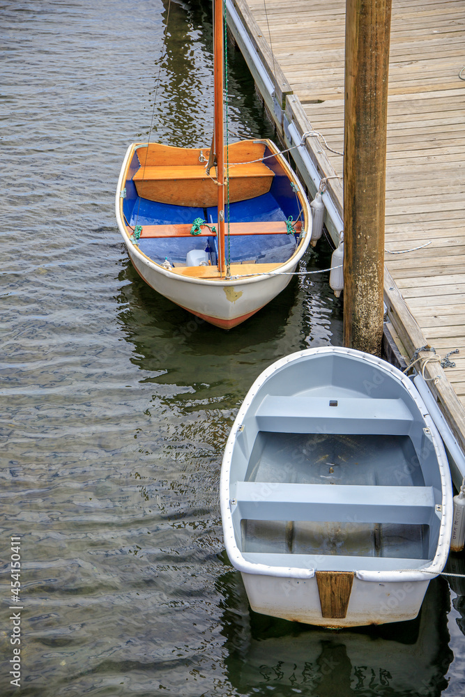 Wall mural Wooden boats near a dock in the harbor