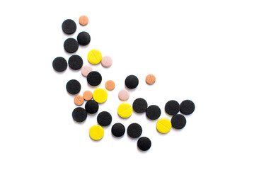 Pills. Multi-colored pills on an isolated white background. Healthcare and medicine.