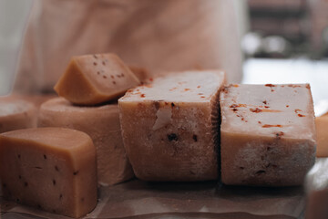 Various types of cheese. Dark moody. Free space for text. Toned. Cheese background.
