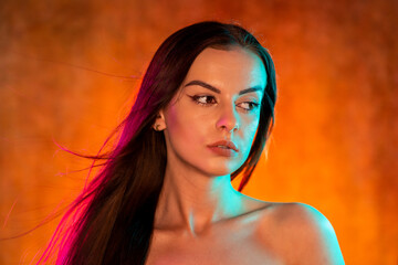 Portrait shot of a pretty young woman in RGB colors.