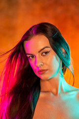 Portrait shot of a pretty young woman in RGB colors.