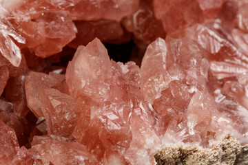 Macro mineral stone Pink Amethyst on a black background