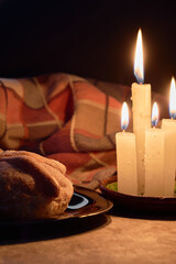 Traditional Mexican bread of the dead. Candle lighting. Enjoyed on the day of the dead. Mexican tradition concept.