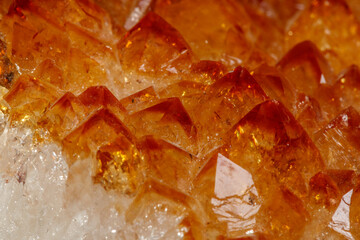 Macro mineral stone Citrine in rock in crystals on a black background