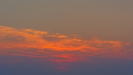 Warm orange sky after sunset over the north sea