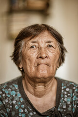 Close-up portrait of an elderly woman.