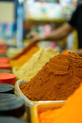 Moroccan spices displayed in a traditional food market.