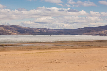 A sandy beach on the bank of the Yenisei River.Russia, Republic of Khakassia