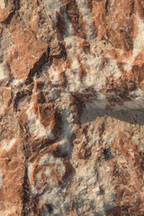 the texture of the raw mineral marble, light streaks on a dark background