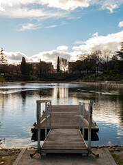 Floating wooden platform in a pond