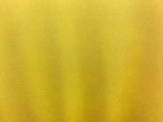 Yellow cotton fabric texture used as background. Empty yellow fabric background of soft and smooth textile material. There is space for text...